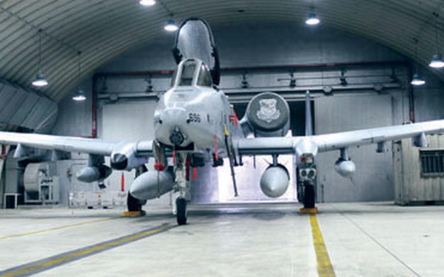 At Osan Air Base in South Korea earlier this month, a newly arrived A-10C ground attack plane assigned to the 25th Fighter Squadron sits in a hanger. The squadron has begun a transition from the A-10A to the newer C-model, which, among other new capabilities, can launch state-of-the-art GPS satellite-guided smart bombs, something the A model could not.