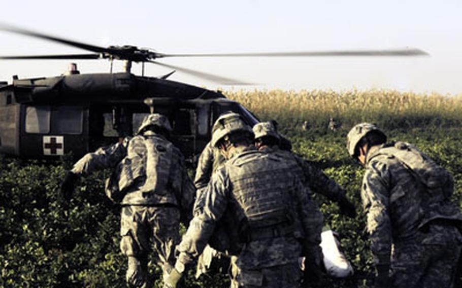 U.S. soldiers carry a comrade to a UH-60 Black Hawk medical evacuation helicopter after he was injured by an improvised explosive device in Fair al Jair, Iraq, on Dec. 16, 2007. A recently-completed study by the Armed Forces Health Surveillance Center found for battle-related injures were responsible for 19 percent of all medical evacuations in Afghanistan and Iraq since October 2001.