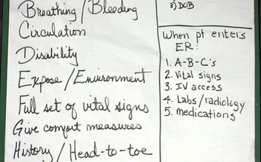 Procedures are outlined on a notepad displayed inside a mobile medical facility set up Tuesday at Camp Stanley.