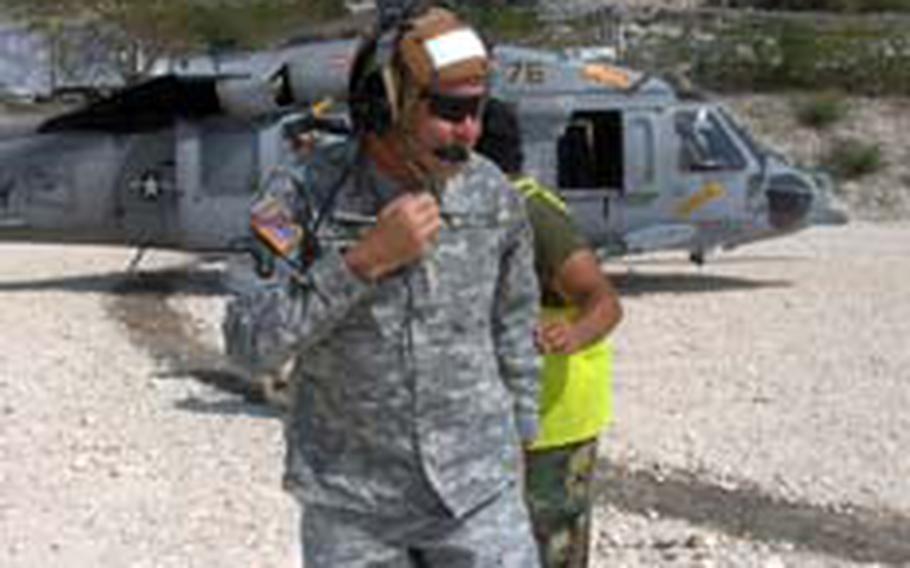 Lt. Gen. Ken Keen, Joint Task Force-Haiti commander, steps off a helicopter in Haiti.