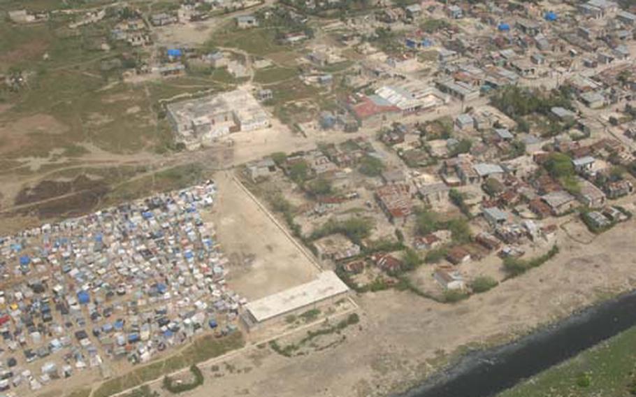 Lt. Gen. Ken Keen looked down from a helicopter circling over earthquake-ravaged Port-au-Prince last Wednesday and saw a patchwork of multicolored tents that had sprouted among the Haitian capital&#39;s rusting corrugated iron roofs and collapsed buildings to house hundreds of thousands left homeless by the disaster.