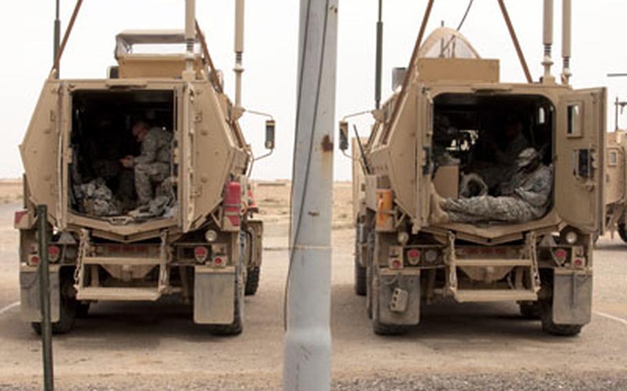 U.S. soldiers relax inside their MRAPs before leaving Forward Operating Base Summerall for good. The sprawling base near Baiji, Iraq, was handed over to the Iraqi government on April 17.