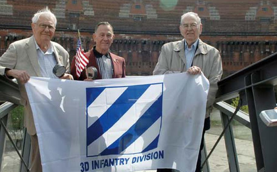 Third Infantry Division World War II veterans, from left, Charles Phallen, William Ryan Jr. and Murray Simon visited the Nuremberg Kongresshalle on Tuesday. The 3rd ID helped liberate Nuremberg in 1945.