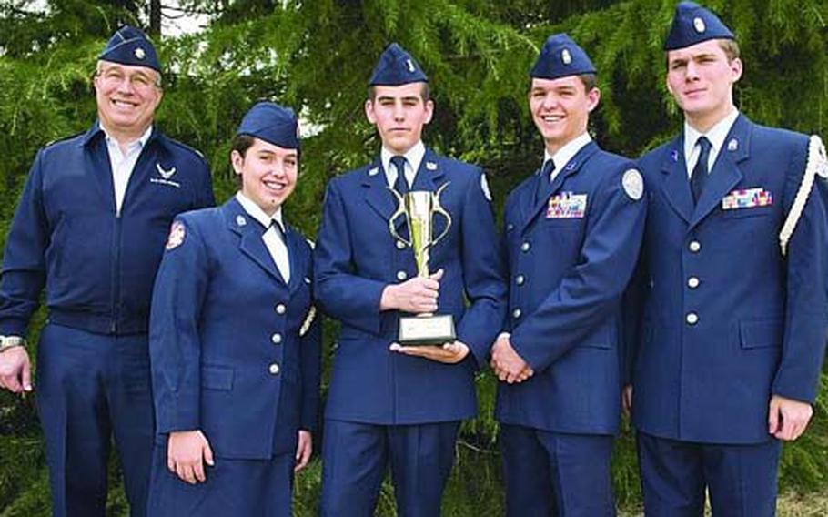 The JRTOC team from Edgren High School on Misawa Air Base, Japan, shows off its trophy after winning the 2010 Air Force JROTC Academic Bowl in Washington, D.C., on April 24. From left are retired Lt. Col. Ted M. Ball, Edgren’s JROTC director; Monica Cronin; Bryan Bancroft; Scott Cronin; and Michael Warden.