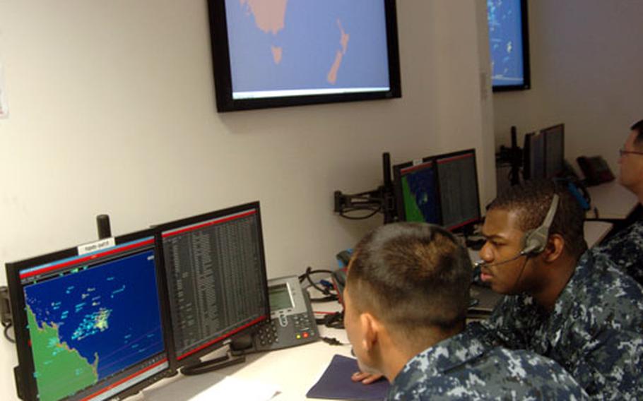 Sailors from the USS Cowpens react to incoming data during Operation Coral Dagger, a four-day bilateral exercise with the Australian Navy that served as the grand opening of a new battle lab at Yokosuka Naval Base on Monday.
