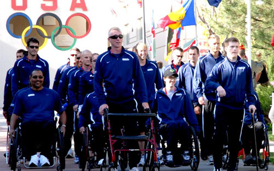 The 25 wounded airmen representing the Air Force in the inaugural Warrior Games in Colorado Springs, Colo., are introduced during the opening ceremony Monday night. About 200 athletes, who have physical and mental injuries and are competing on behalf of their services, will face off in events such as sitting volleyball, archery, shooting and wheelchair basketball.