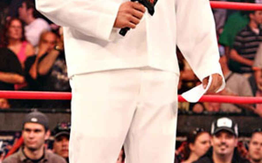 Jesse Neal talks to the audience while wearing his old Navy uniform during one of his early TNA Wrestling appearances in 2009.
