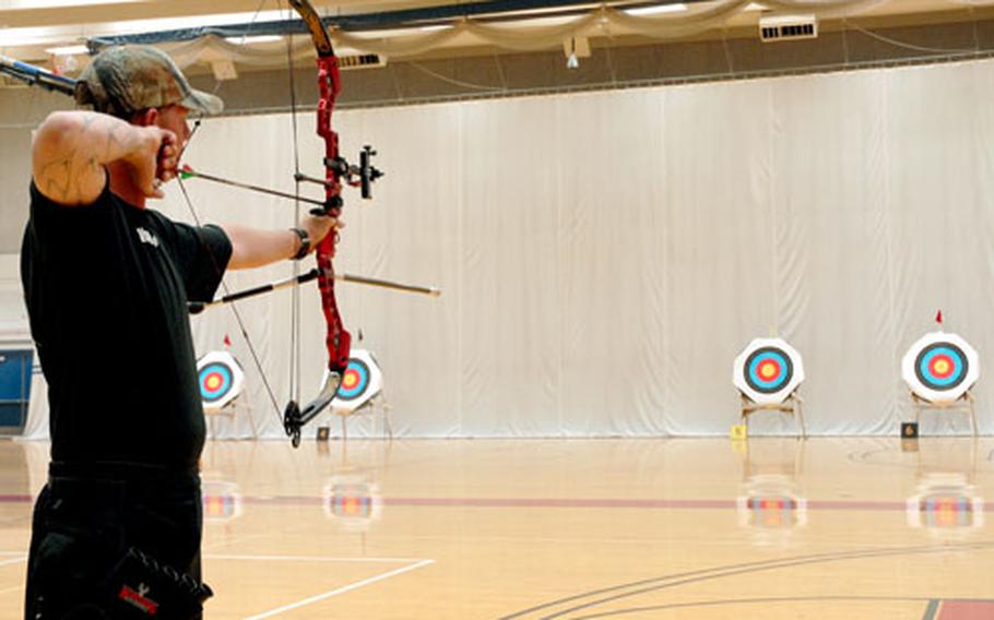 Spc. Travis Akin, who has TBI and PTSD, competes for bronze Tuesday in the archery competition of the inaugural Warrior Games for wounded service members at the Olympic Training Complex in Colorado Springs, Colo. He lost out on the medal to fellow soldier Sgt. Robert Price.