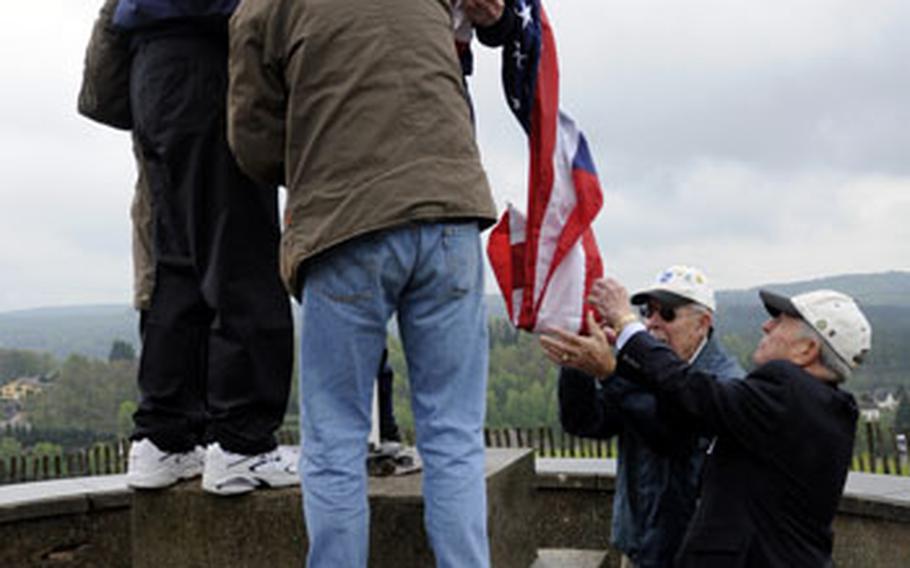 Retired servicemembers of the 100th Infantry Division and family members raise the American flag over the Citadel of Bitche, France, on May 7. The 100th Division is now known as the "Sons of Bitche" for its efforts in liberating the town from the Nazis.