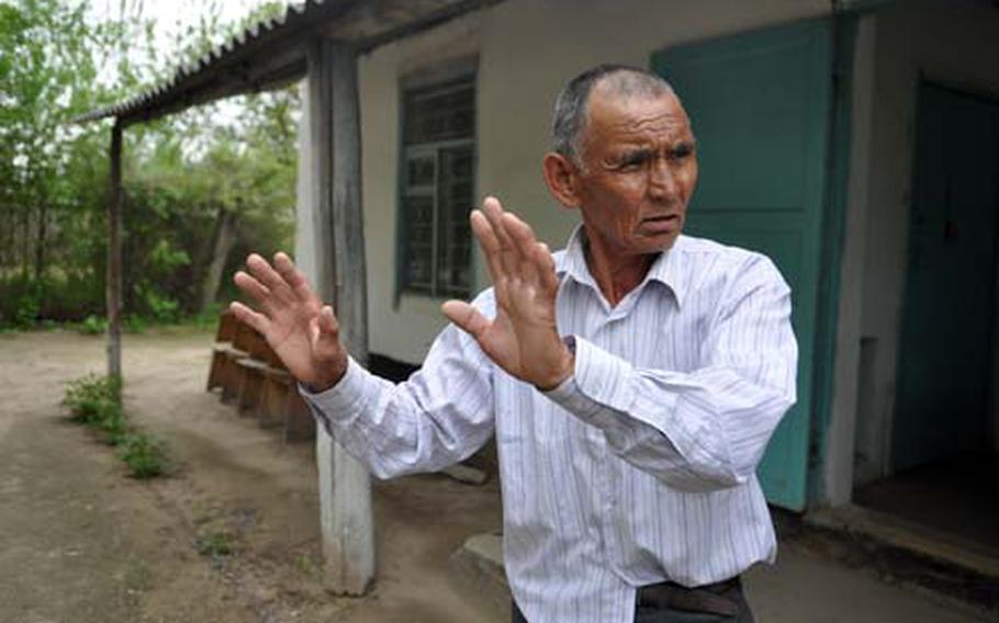 Mayrambek Turpanov, 70, lives in the village of Dacha, Kyrgyzstan, which borders Manas air base. Like many residents, Turpanov complains about noise from the base and says pollution from it has made it difficult to grow vegetables in his garden and is killing the small forests that dot the area.