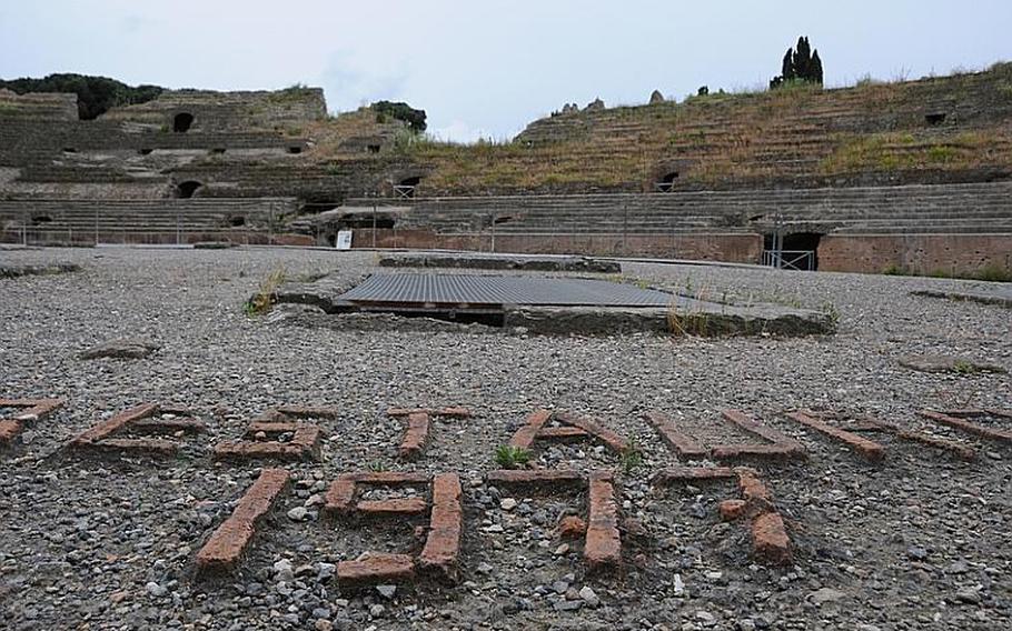 Bricks form the numeral 1977, the year that the last major restoration was done to the Flavio amphitheater in Pozzuoli, Italy. The amphitheater is the third largest surviving theater of the Roman empire.
