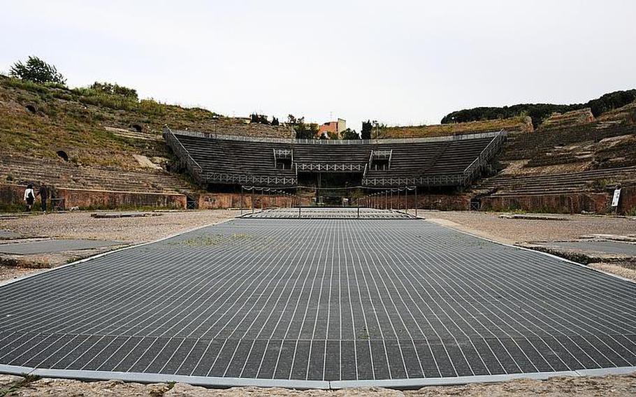 The vast center arena of the Flavio amphitheater in Pozzuoli, Italy, is where gladiators met their fate, often against exotic animals such as tigers and lions. The gladiators fought to the end - they were either mauled to death, or managed to slay their adversaries. The metal grates cover a large channel in the middle of the arena through which decorative scenes were raised from the underground cells.