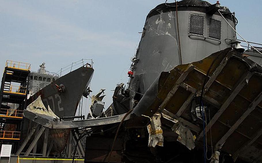 This May 19, 2010, file photo shows the broken smokestack of the Cheonan as it sat in front of the wreckage of the ship's bow at a South Korean naval base in Pyeongtaek. South Korea said that a North Korea torpedo split the ship in half, killing 46 troops on March 26, 2010, and separating the smokestack from the ship.