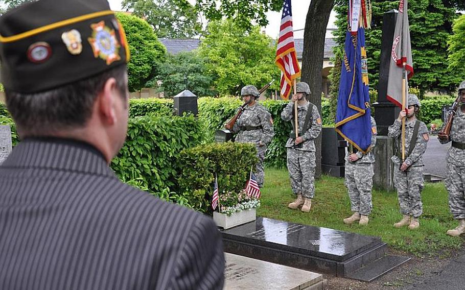 Gregory Obert looks on during a ceremony Sunday at the Bamberg city cemetery to honor the 20 U.S. servicemembers who are buried there.