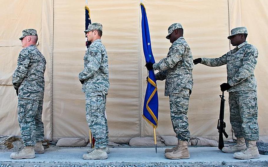 Members of an Air Force color guard make final adjustments just minutes before a Memorial Day ceremony begins Monday at Kandahar Airfield in Afghanistan.