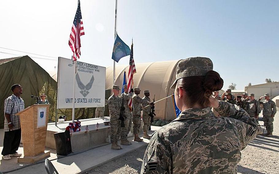 The American flag flies at half-staff while airmen salute during the singing of the national anthem during a Memorial Day ceremony Monday at Kandahar Airfield. The small event took place just a few hours after the body of a Marine killed in combat Sunday was flown home, said Chief Master Sgt. Steve McDonald, of the 451st Air Expeditionary Wing. The number of U.S. servicemembers killed in Afghanistan reached 1,000, The Associated Press reported last week.