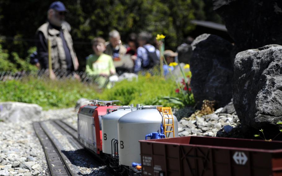 Visitors to the island of Mainau watch a model train approach on June 4. The train is situated between a playground and fields of flowers on the island in Lake Constance.