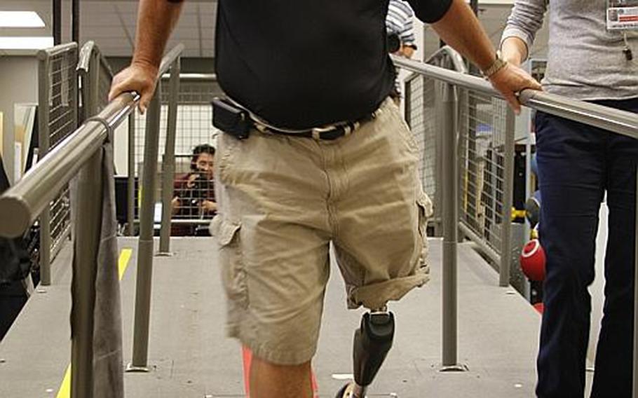 Vietnam veteran John Loosen, who lost his leg in a mortar attack in 1968, shows off his new X2 prosthetic leg at Walter Reed Army Medical Center on Wednesday. Loosen is the first Vietnam veteran to receive the high-tech device through a new pilot program designed to get state-of-the-art technology to older veterans.