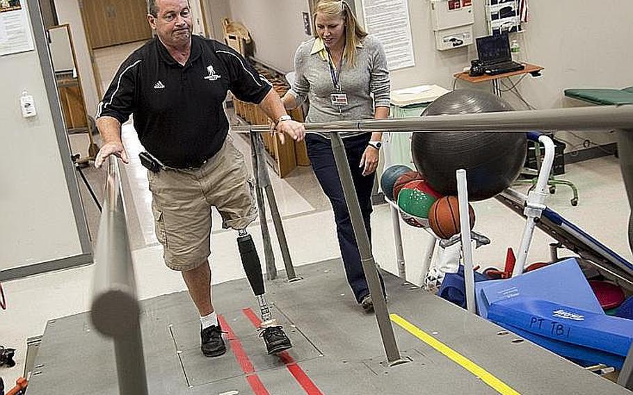 Vietnam veteran John Loosen, who lost a leg in Vietnam, shows off a new X2 prosthetic knee during a photo opportunity with his physical therapist Lindsay Martin, right, Wednesday at Walter Reed Army Medical Center in Washington. Loosen is the first Vietnam Veteran to get this new technology in prosthetics. 