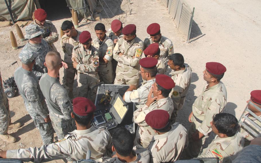 U.S. soldiers with the 66th Engineer Company, part of the support battalion, go over a mock bomb inspection before letting the Iraqi soldiers practice. Some of the training is done on Iraqi bases, as here. Later this year, the Iraqi soldiers will train at nearby Forward Operating Base Warhorse, a U.S.-controlled base where the Iraqis will eat, sleep and work with the American troops.