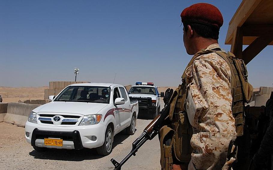 At the checkpoints inside the CSA, equal numbers of Iraqis and Kurds man the roads 24 hours a day. At times, they stop each car for a quick inspection. Other times, they wave through taxi cabs, families in sedans, oil tankers and tourist buses heading west from the Iranian border, carrying Shiite pilgrims to visit Iraqi's holy sites.