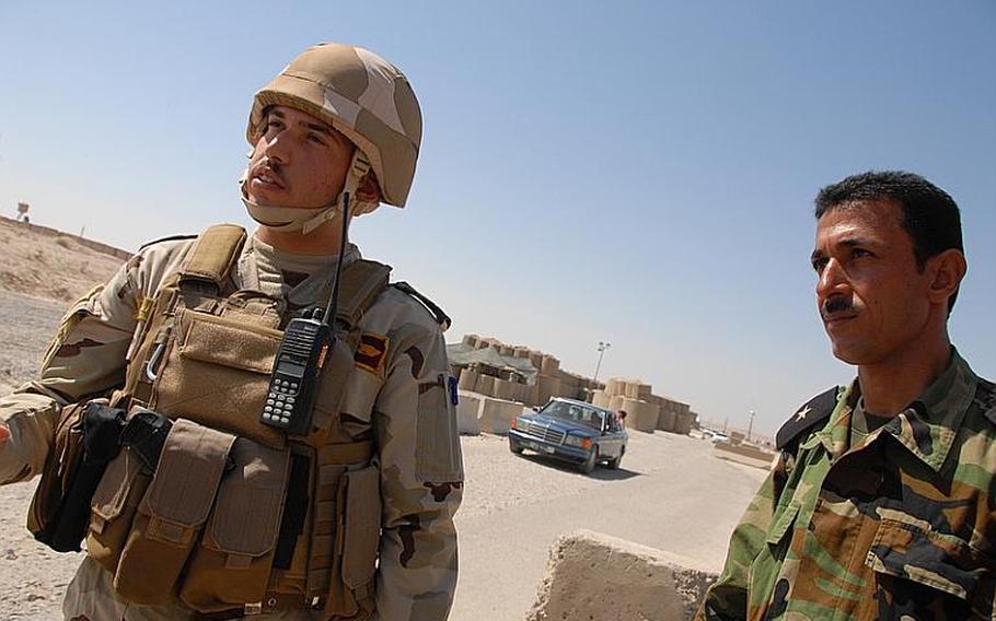 At Checkpoint 4, 2nd Lt. Haidar Essam Adnan, an Iraqi officer, (left) and 2nd Lt. Salah Mohammed Fath, a Peshmerga officer, call each other friends. "We are just one force, helping each other," the Iraqi officer said. "Just the names are different." Salah, the Kurd, said the governments are working to combine the two forces, that one day soon his soldiers will wear the Iraqi Army uniform. "I'll be more than happy to wear that uniform," Salah said.