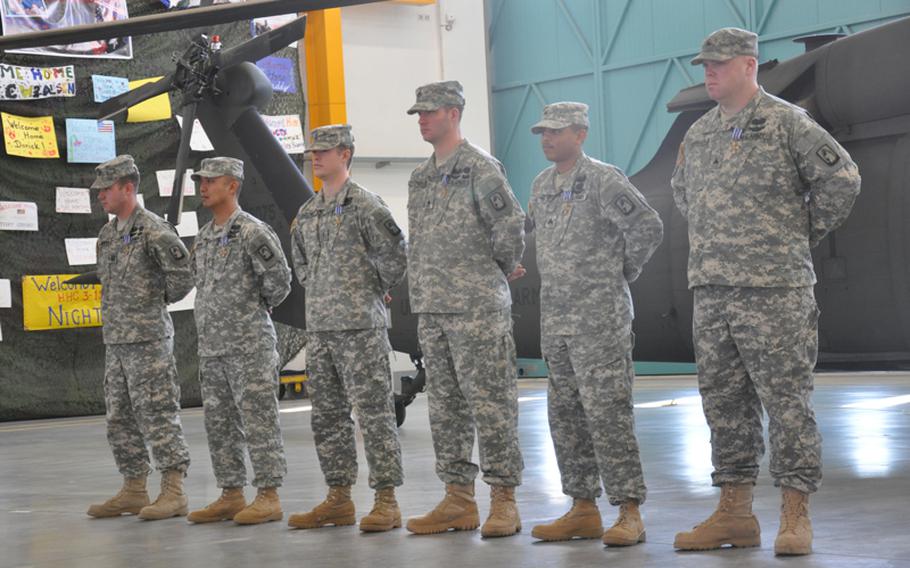 From right to left: Sgt. Steven Shumaker, Sgt. Antonio Gattis, Staff Sgt. Travis Brown, Chief Warrant Officer 2 Jason Brown, Chief Warrant Officer 3 Nelson Visaya and Capt. Robert McDonough were awarded the Distinguished Flying Cross in a ceremony Monday in Katterbach, Germany, for their heroic actions in rescuing German soldiers wounded in a Taliban ambush April 2 near Kunduz in northern Afghanistan.