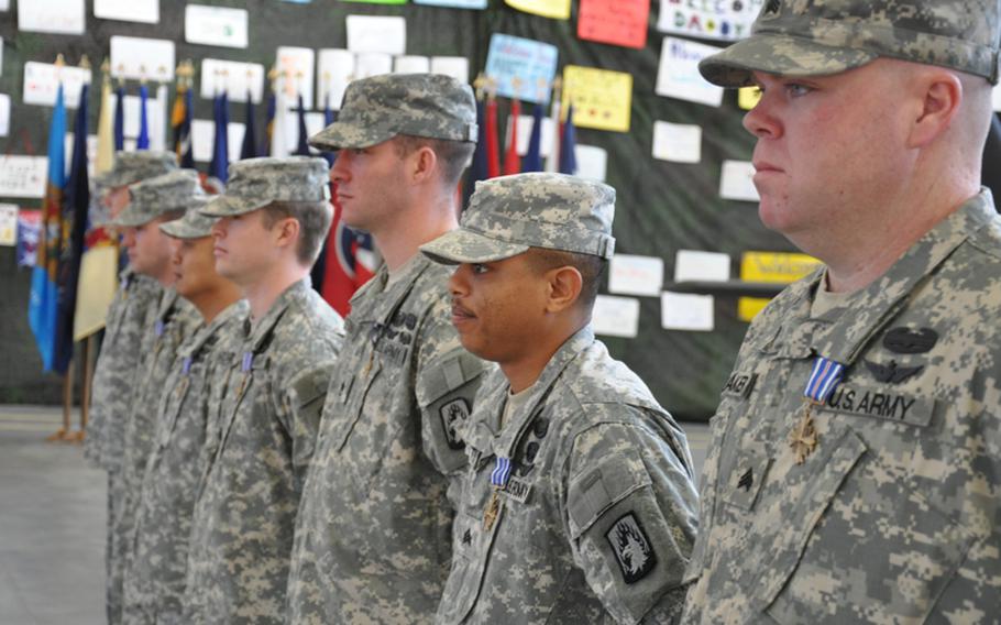 From right to left: Sgt. Steven Shumaker, Sgt. Antonio Gattis, Staff Sgt. Travis Brown, Chief Warrant Officer 2 Jason Brown, Chief Warrant Officer 3 Nelson Visaya, Capt. Robert McDonough and Chief Warrant Officer 3 Jason LaCrosse stand during an award ceremony Monday in Katterbach, Germany. LaCrosse was awarded a Silver Star and the other soldiers were awarded Distinguished Flying Crosses for their heroic actions in rescuing German soldiers who were wounded in a Taliban ambush April 2 near Kunduz in northern Afghanistan.