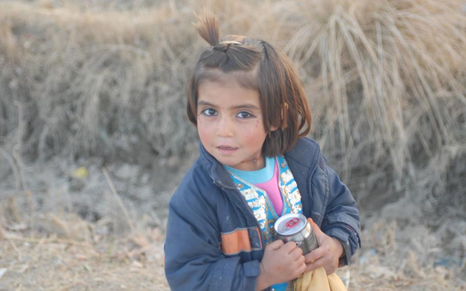 A little girl in Marjah agrees to have her photo taken. Schools might open for a couple of hours a day then close when teachers or children stop showing up.