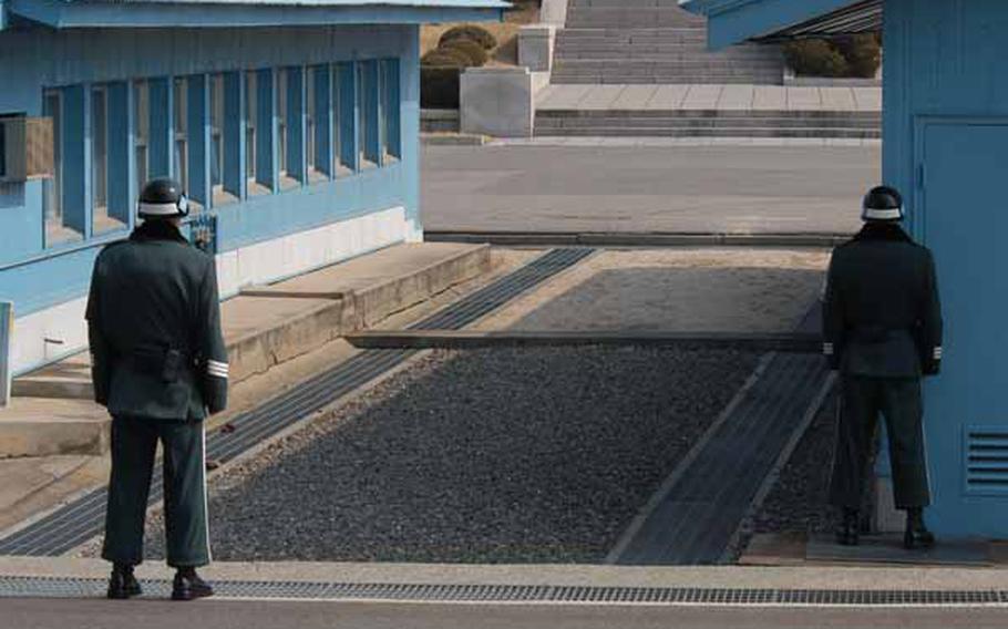 South Korean soldiers stand guard as a tour group is led through the Joint Security Area of Korea&#39;s Demilitarized Zone on Wednesday.