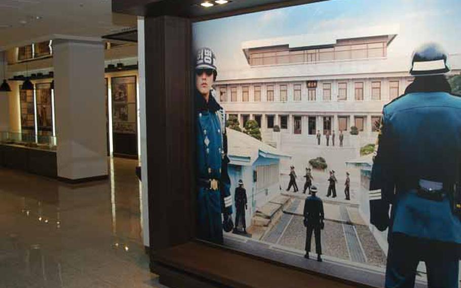 A picture of the Joint Security Area of Korea&#39;s Demilitarized Zone greets tourists in the museum area of a new visitor center near the popular tourist destination.