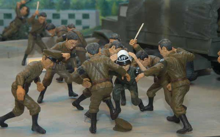 In a display at the new Joint Security Area Visitor Center at Korea&#39;s Demilitarized Zone, figurines depict the Aug. 18, 1976 "Axe Murder Incident" in which two U.S. soldiers were killed and nine other Americans and South Koreans were injured.