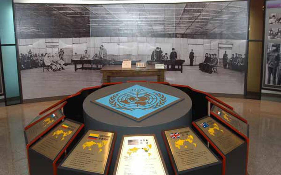 Monuments, in the foreground, commemorate the participation of every nation that came to the defense of South Korea during the Korean War at the newly opened Joint Security Area Visitor Center at Korea&#39;s Demilitarized Zone.