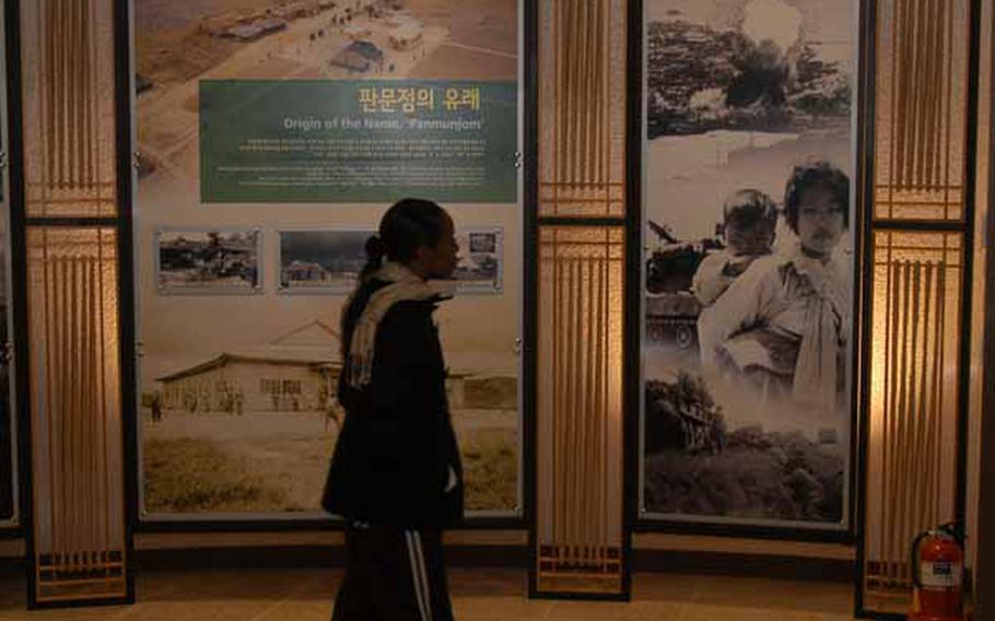 U.S. Army Capt. Tanisha Currie looks at exhibits Wednesday in the new Joint Security Area Visitor Center at Korea&#39;s Demilitarized Zone.