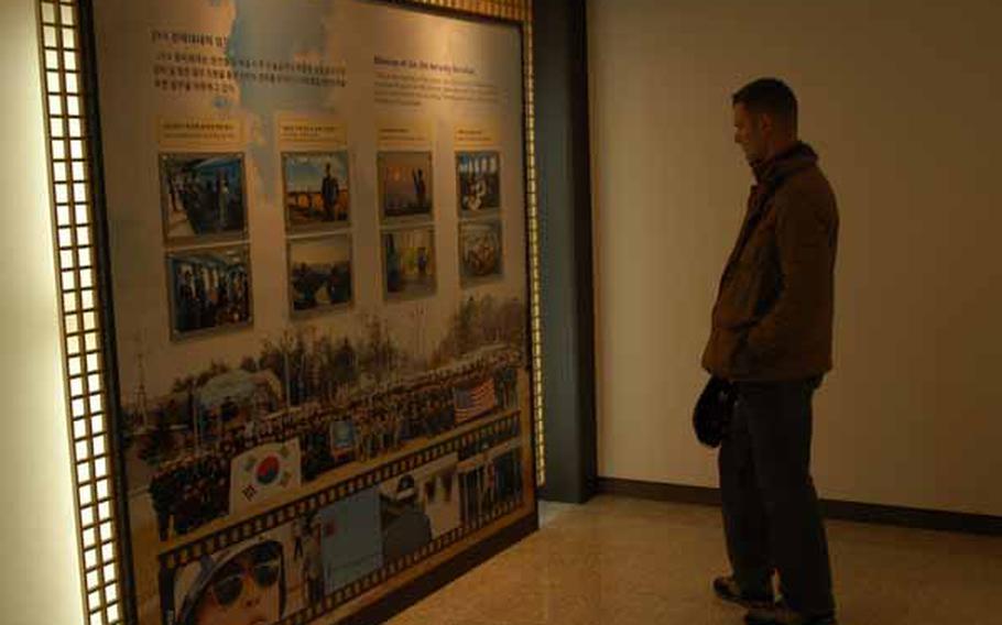 U.S. Army 1st Lt. Brian Baker looks at an exhibit Wednesday in the Joint Security Area Visitor Center at Korea&#39;s Demilitarized Zone.