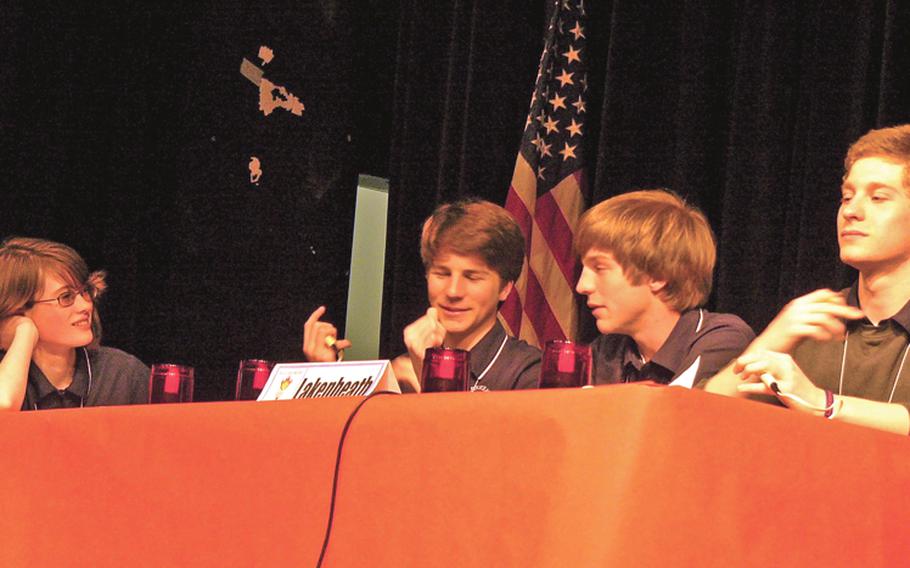 Lakenheath junior Colin McDonnell, second from left, answers a question Wednesday during the championship game of the 2011 All-Europe Academic Bowl in Baumholder, Germany. The Lakenheath team -- from left, Hayley Outlaw, Colin McDonnel, brother Ryan McDonnell and team captain Joe Sullivan -- defeated defending champion Ramstein 40-30 in a 10-question playoff.