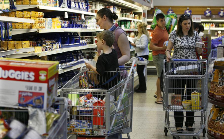 Shopper fill the aisles at the commissary at Ramstein Air Base in Germany on Friday. People were out in force stocking up in case the commissaries closed due to the government shutdown.