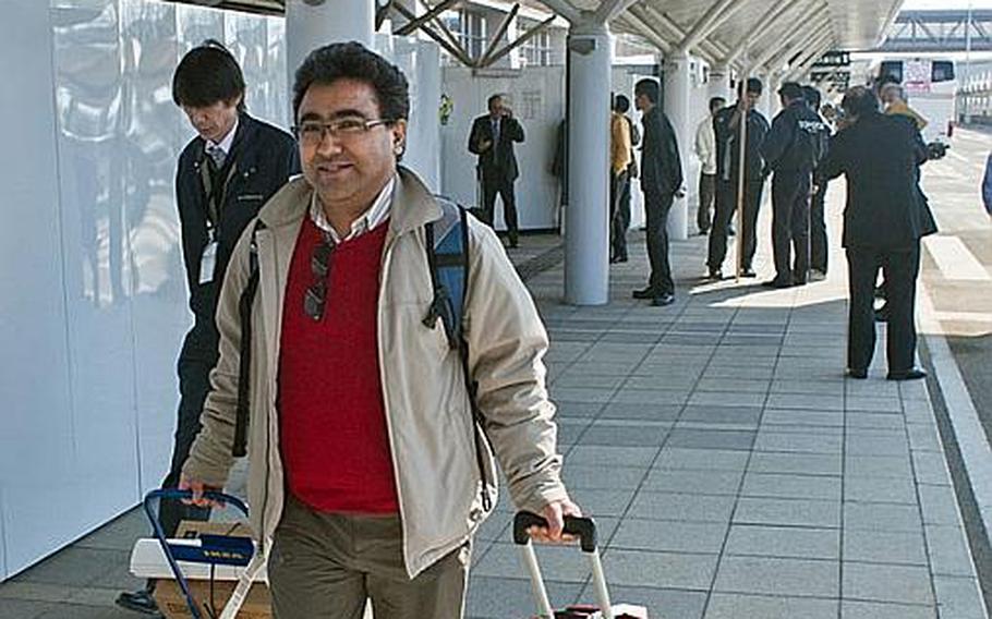 Among the passengers of the first flight to land at Sendai Airport in Sendai, Japan, since the March 11 tsunami was Dr. Stobdan Kalon, who came to the region to work with the Doctors Without Borders organization.