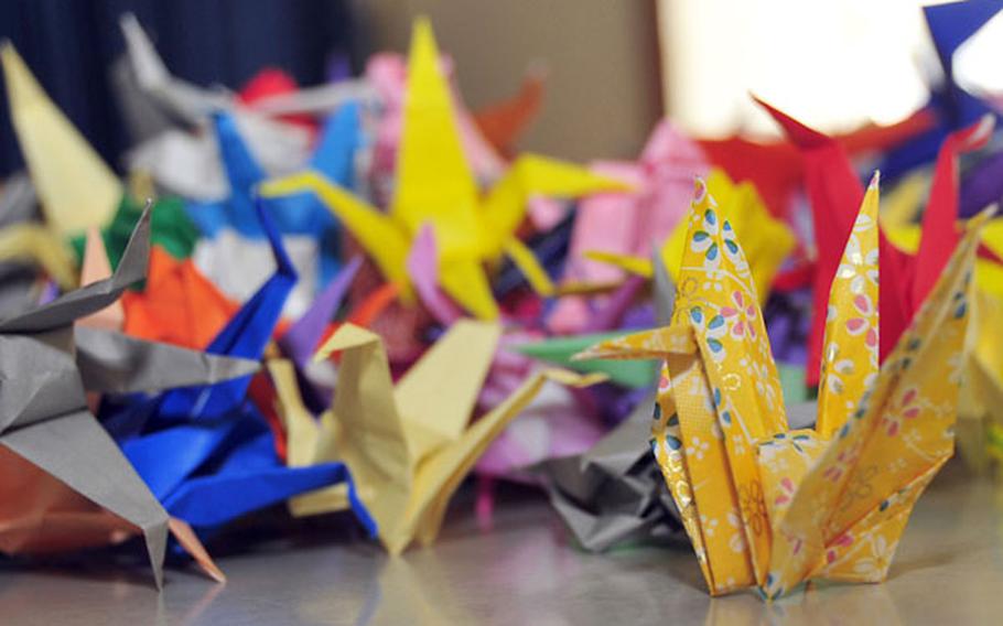 Origami cranes sit on a table at Sollars Elementary School, Misawa Air Base, Japan, on April 6 before being packed into boxes to be mailed to the United States.