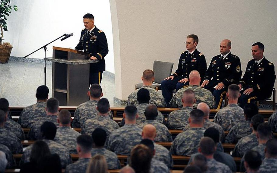 Rear detachment commander Lt. Col. Steven Fandrich speaks to mourners at the memorial service for Staff Sergeants Scott Burgess and Michael Lammerts at a memorial ceremony in Baumholder, Germany, on Wednesday. The 1st Battalion, 84th Field Artillery Regiment, 170th Infantry Brigade Combat Team soldiers were killed in Afghanistan on April 4.