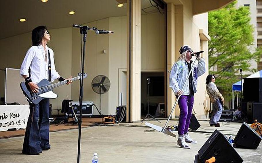 ATs*69 performs their renditions of popular 80s rock at the Sakura Shell on Yokota Air Base Saturday for &#39;Tomodachi Stock,&#39; a free concert held to raise money through concessions and Red Cross donations for the tsunami victims in northern Japan.