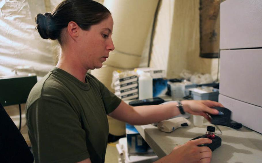 Petty Officer 1st Class Jennifer L. Nolen, from High Point, N.C., a preventive medicine technician with the Public Health and Preventive Medicine Detachment, Alpha Surgical Company, 2nd Marine Logistics Group (Forward), tests water samples at the laboratory June 20 at Camp Leatherneck, Helmand province, Afghanistan. The sailors with the detachment and civilians with the Leatherneck Water Point are capable of identifying bacterial and chemical contaminants that pose health risks, such as chlorides, cyanide, sulfates, and arsenic, ensuring troops have safe water for personal hygiene and consumption.