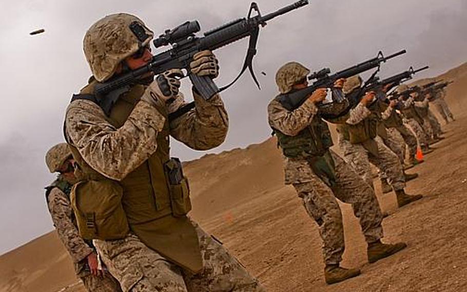 Lance Cpl. Justin Roy of Lafayette, La., an infantryman who serves with Company F, Anti-terrorism Battalion, 4th Marine Division, engages targets during live-fire urban combat marksmanship training conducted by U.S. Marines and Moroccan soldiers at Morocco Military Base Tifnit May 19. 