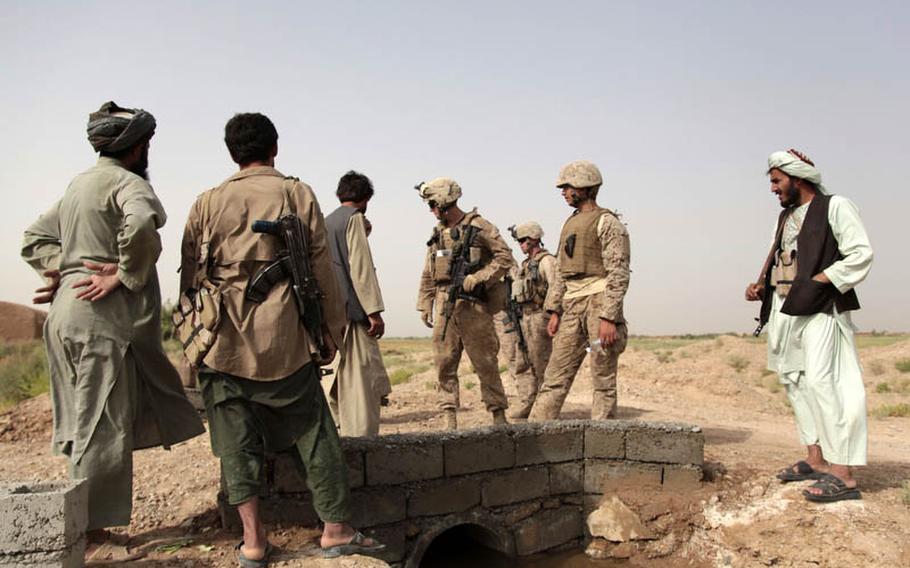 Rafiullah, commander of a local defense force known as the ISCI, or Interim Security for Critical Infrastructure, takes Marines from Company G&#39;s 3rd Platoon on a tour of a small bridge he arranged to have built with Marine money. The Marines funnel funds for projects through the ISCI in order to lure local support for the Afghan government.