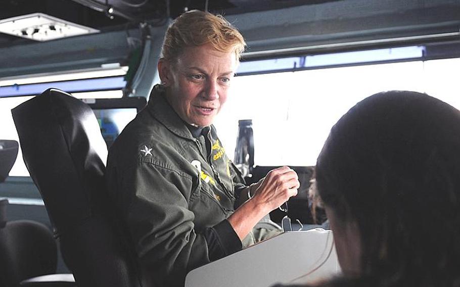 Last year, Rear Adm. Nora Tyson become the first female commanding officer of a carrier strike group. Now leading the group on its deployment aboard her flagship the aircraft carrier USS George H.W. Bush, Tyson--shown here last month on the Bush flag bridge--is nonchalant about being the woman that broke this glass ceiling. "To me, it&#39;s all about professionalism, doing the job to the best of your ability," she said.