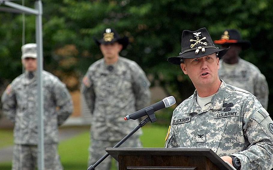 Col. James R. Blackburn Jr. of the 2nd Stryker Cavalry Regiment speaks at Friday's uncasing of colors and memorial ceremony in Vilseck. Twenty soldiers from the regiment were killed during deployment to southern Afghanistan between June 2010 and 2011. 

Steven Beardsley/Stars and Stripes