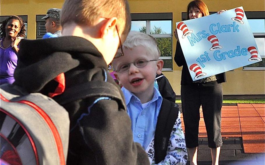 First-grade teacher Julie Clark herds her new pupils into a line Monday, the first day of school at Smith Elementary on U.S. Army Garrison Baumholder in Germany. For Clark, it was her first day as well at Smith Elementary School, having come from a school in the Pacific.