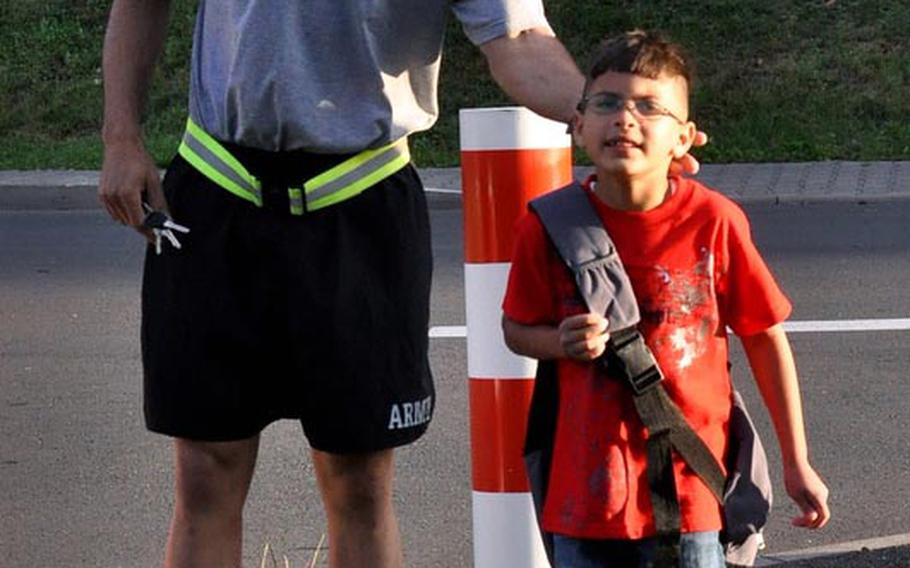 Staff Sgt. Malquer Manzueta says goodbye to his 8-year-old son Miguel, as he heads off to his first day of school at Smith Elementary on U.S. Army Garrison Baumholder in Germany. Manzueta, of Headquarters and Headquarters Battery 1-84 Field Artillery, said his son was starting the 3rd grade.