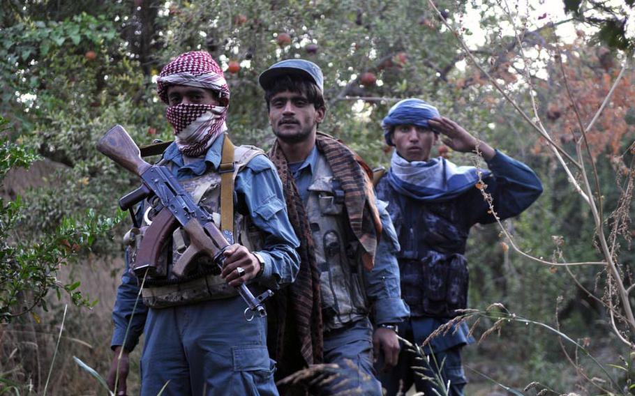 Afghan policemen during a recent raid near the village of Now Ruzi, Kandahar province.