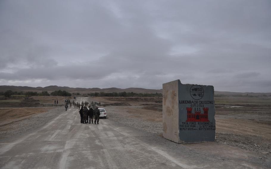 Afghan and American soldiers gather for a ribbon-cutting ceremony along a new bridge near the village of Gormach in western Faryab province. The bridge spans a wadi that once formed a barrier between Pashtun villages and the rest of Faryab, which is dominated by Uzbeks, Tajiks, and Turkmen.